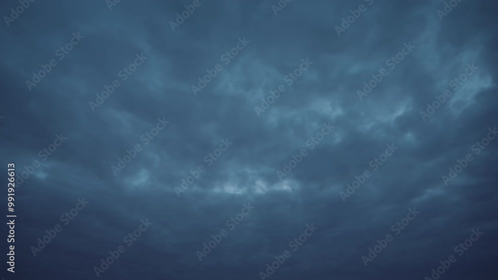 Timelapse view of a dark blue sky with moving clouds, moments before the storm. Beautiful nature background with deep blue sky and clouds. Dusk to night timelapse shot of cloudy sky. Timelapse view of a dark blue sky with moving clouds, moments before the storm. Beautiful nature background with deep blue sky and clouds. Dusk to night timelapse shot of cloudy sky.