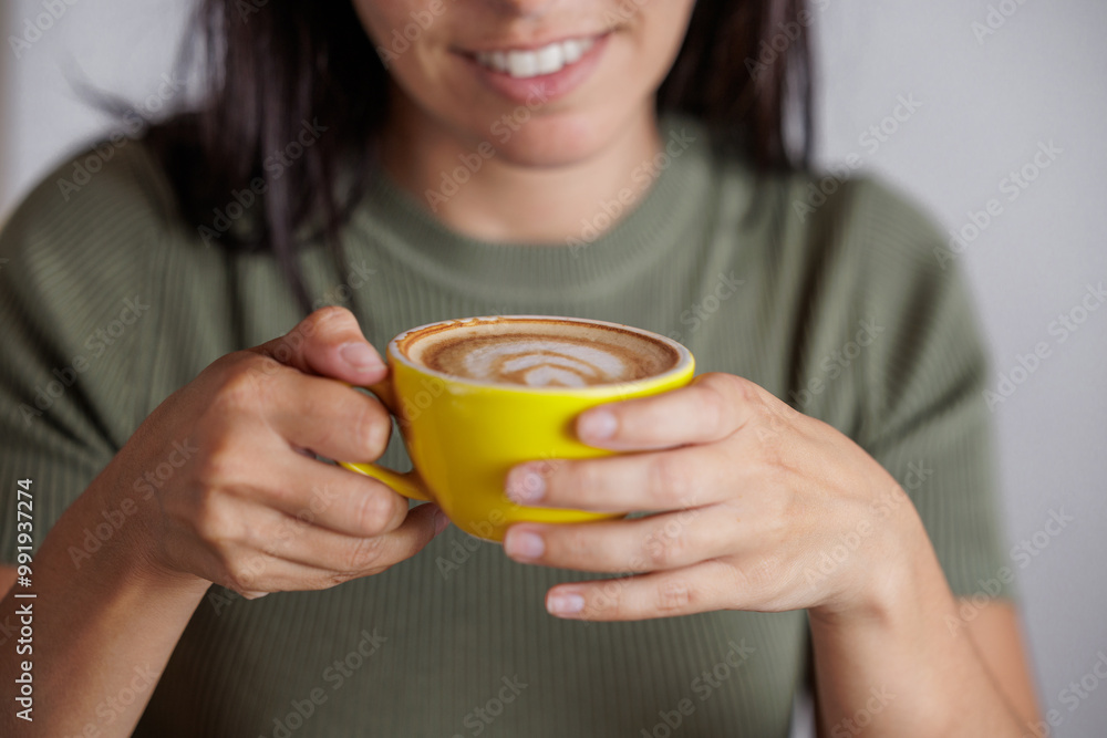 Portrait of young woman drinking coffee in a cafe. Enjoying its aroma. Nothing like a good coffee in the morning. Dose of caffeine. Enjoying moments alone with oneself. Portrait of young woman drinking coffee in a cafe. Enjoying its aroma. Nothing like a good coffee in the morning. Dose of caffeine. Enjoying moments alone with oneself.