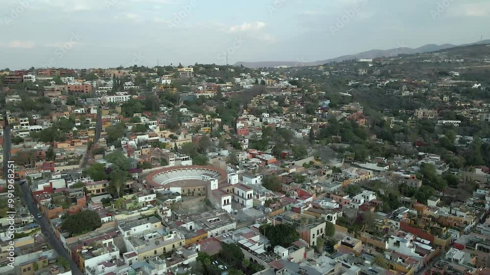 Flyover San Miguel Mexico rooftops to Plaza de Toros bullring arena Flyover San Miguel Mexico rooftops to Plaza de Toros bullring arena