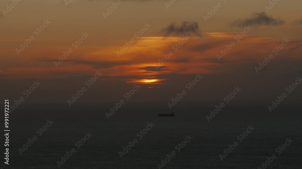 Wide View Timelapse of Sunset and Clouds Moving with Cargo Shipping Vessel Moving Across Bristol Channel Calm Sea. Filmed from Exmoor Coastline 4K Wide View Timelapse of Sunset and Clouds Moving with Cargo Shipping Vessel Moving Across Bristol Channel Calm Sea. Filmed from Exmoor Coastline 4K