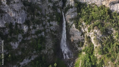 Seerenbach Falls Over Sheer Rock Mountain Near Betlis On The Walensee In Amden Switzerland. Aerial Pullback Shot photo