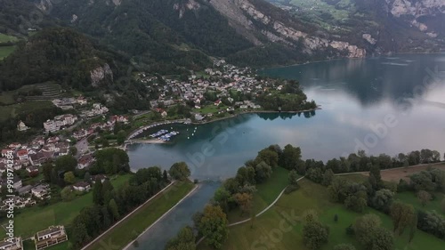 Village Of Weesen And Walensee Lake In The Canton Of St. Gallen, Switzerland. Aerial Drone Shot photo