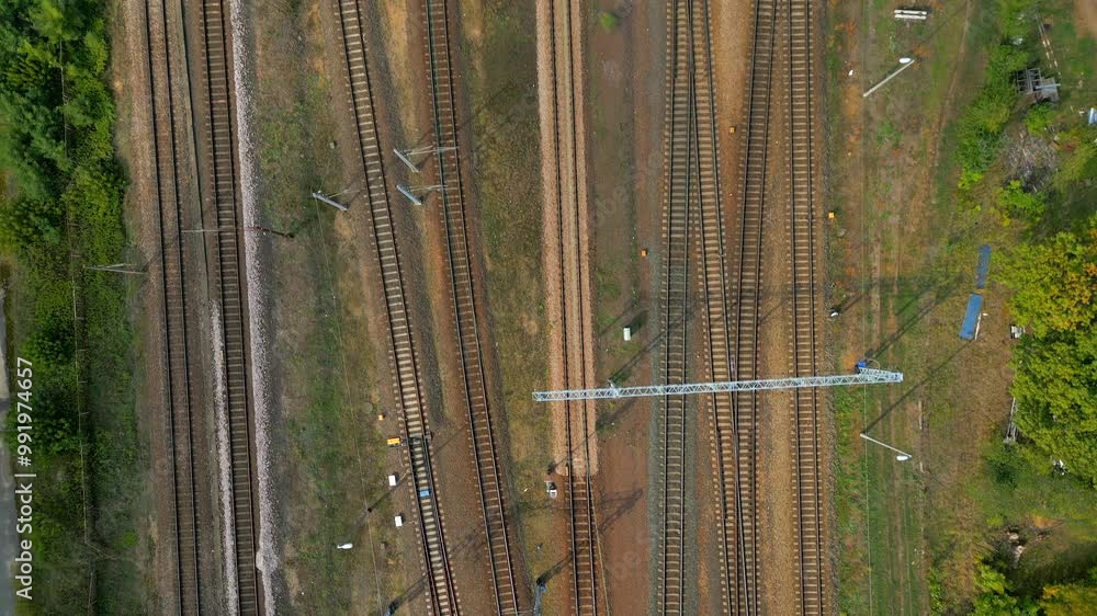 On quiet electric tracks they lay, waiting for trains to come their way On quiet electric tracks they lay, waiting for trains to come their way