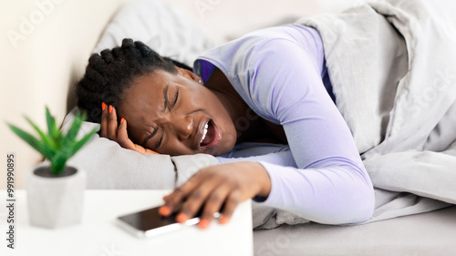 Morning Headache. Afro Woman Touching Head Suffering From Pain Lying In Bed Awaking At Home