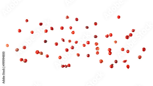 Pink peppercorn  pepperberry  flying isolated on white background. Aromatic spicy ingredient for cuisine.