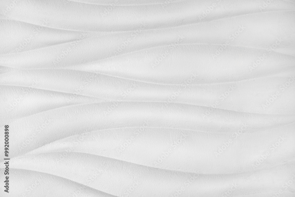 Obraz premium Plaster wall with volumetric relief surface wavy form pattern, white gypsum texture panel.