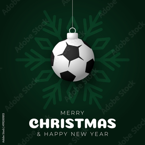 soccer Christmas Greeting card. Merry Christmas and happy new year sport greeting card. Hang on a thread green and red xmas ball bauble photo