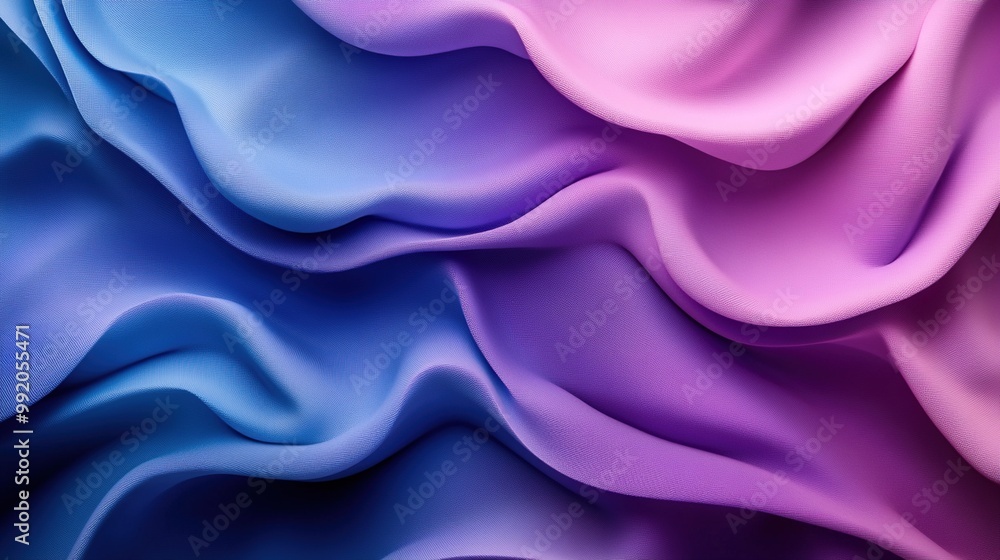 Obraz premium A high-resolution, minimalist abstract background featuring fluid waves of vibrant colors in shades of blue and purple.