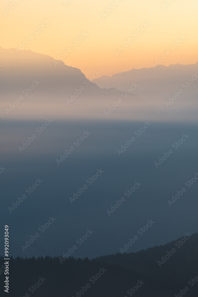 Obraz premium Foggy Sunrise Over The Dolomites From The Passo di Monte Giovo