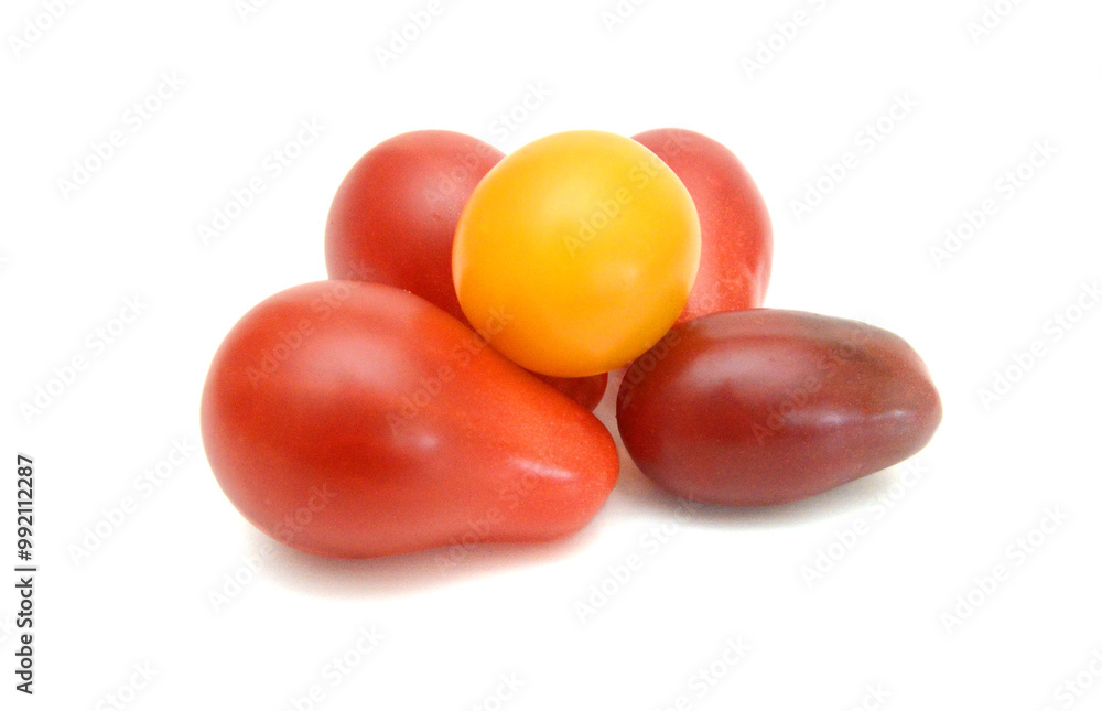 Mini black, red, and yellow tomatoes isolated on white Mini black, red, and yellow tomatoes isolated on white