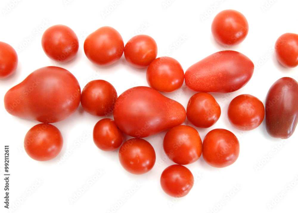 Mini black, red, and yellow tomatoes isolated on white Mini black, red, and yellow tomatoes isolated on white