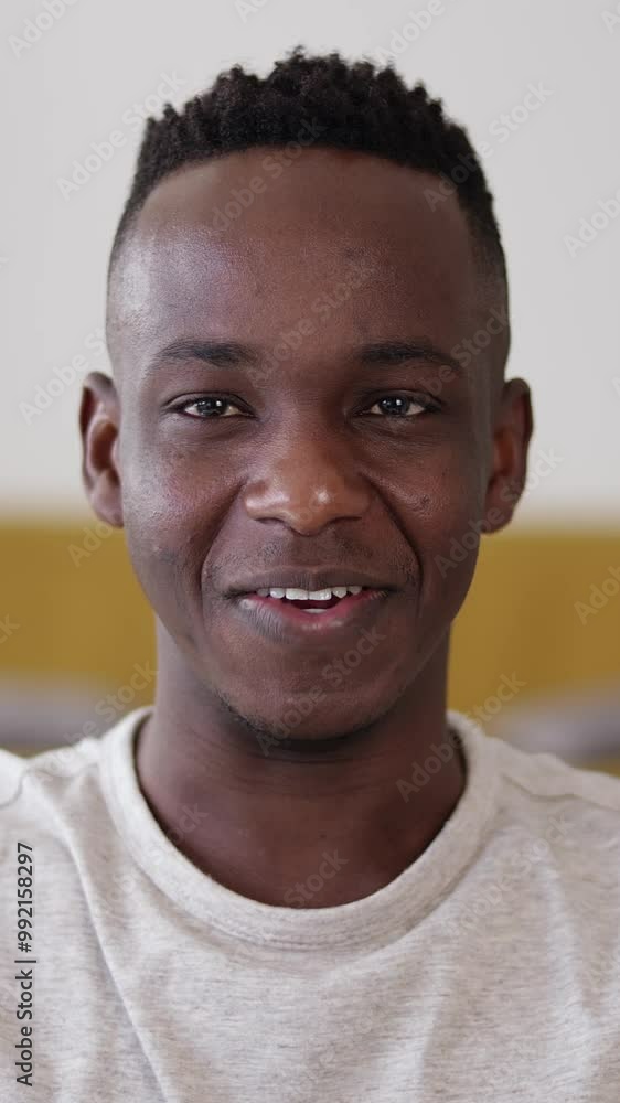 POV of young friendly adult African man speaking at camera through video call using electronic device, smartphone or laptop computer. POV of young friendly adult African man speaking at camera through video call using electronic device, smartphone or laptop computer.