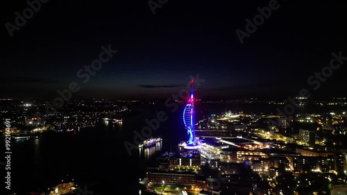 Wallpaper Mural High Angle Night Footage of Illuminated Portsmouth Central City and Docks on Ocean Edge at Just After Sunset Time. England United Kingdom. May 15th, 2024 Torontodigital.ca