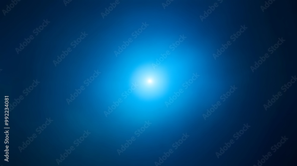 A Bright White Light in the Center of a Dark Blue Gradient Background A Bright White Light in the Center of a Dark Blue Gradient Background