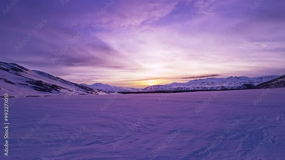 As the sun sets, a breathtaking view reveals a snow-covered expanse surrounded by majestic mountains, painted in soft purple and pink tones As the sun sets, a breathtaking view reveals a snow-covered expanse surrounded by majestic mountains, painted in soft purple and pink tones