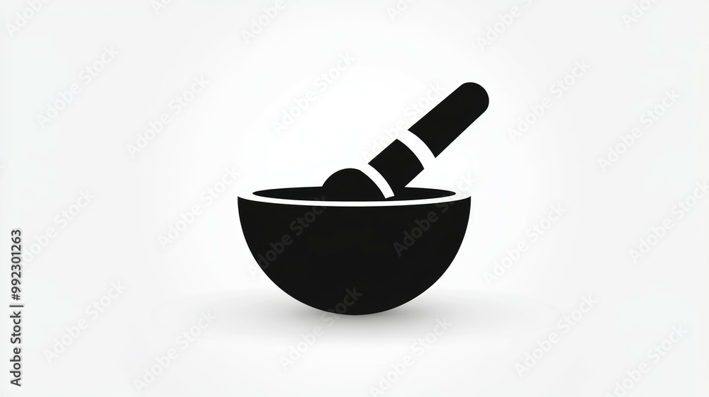 A bowl with a spoon in it A bowl with a spoon in it