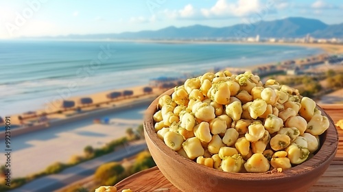 Ackee fruits nestled a wooden bowl placed on a sandy beach with the gentle waves and distant islands softly blurred in the background capturing their tropical essence Scientific name Blighia sapida