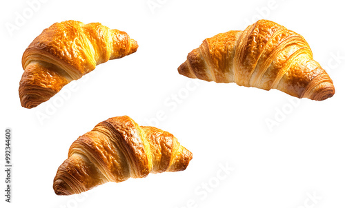 Three croissants are flying in the air