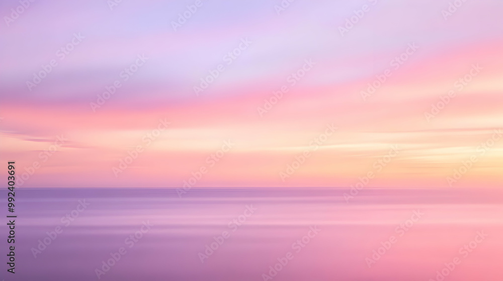 Abstract Background of Pastel Pink and Yellow Skies Over a Blurred Ocean Horizon Abstract Background of Pastel Pink and Yellow Skies Over a Blurred Ocean Horizon