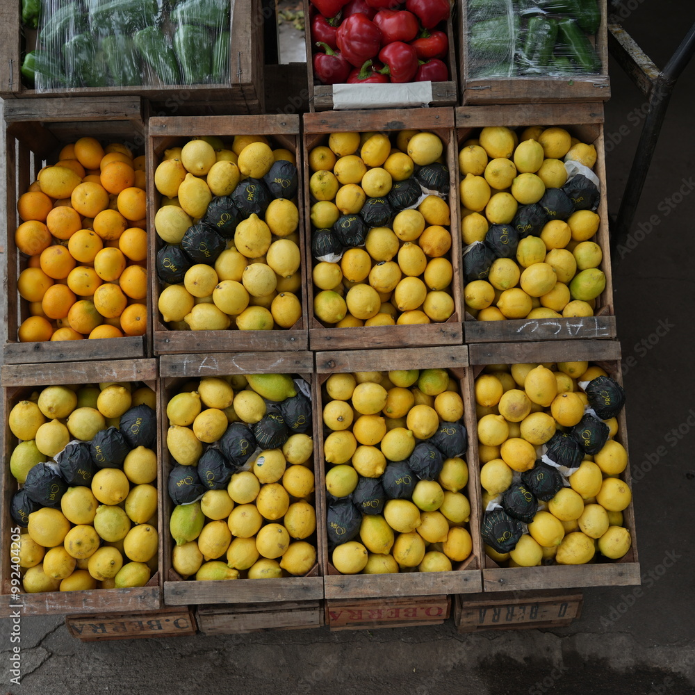 Crates of fresh fruits and vegetables in a traditional grocery store with a variety of healthy and colorful products displayed on wooden shelves Crates of fresh fruits and vegetables in a traditional grocery store with a variety of healthy and colorful products displayed on wooden shelves