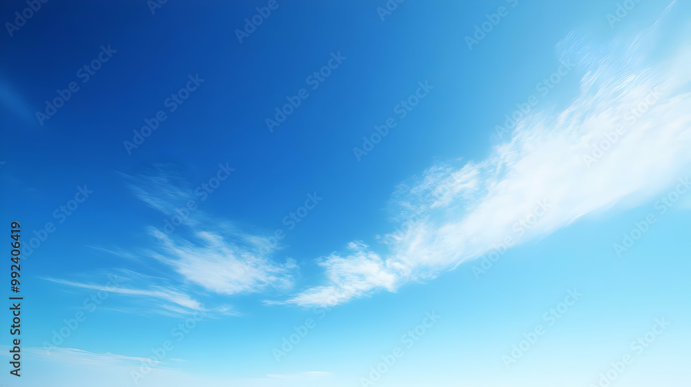 Beautiful Blue Sky with White Clouds Streaks, a Natural Background for Digital Art or Design Beautiful Blue Sky with White Clouds Streaks, a Natural Background for Digital Art or Design