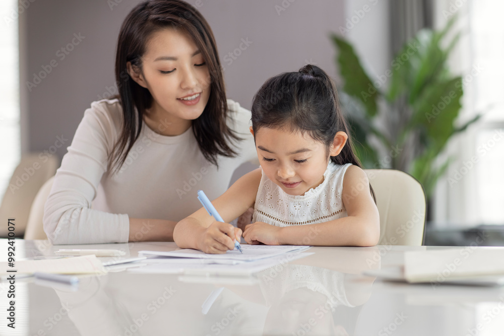 Mum Helping Daughter With Her Homework Mum Helping Daughter With Her Homework