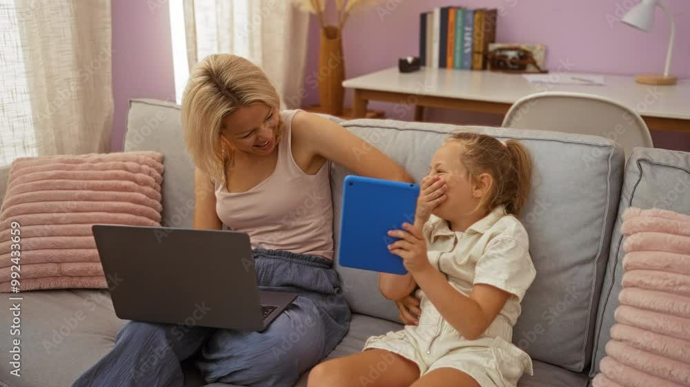 Mother and daughter bond in a cozy living room with a laptop and tablet, highlighting family moments and home comfort Mother and daughter bond in a cozy living room with a laptop and tablet, highlighting family moments and home comfort