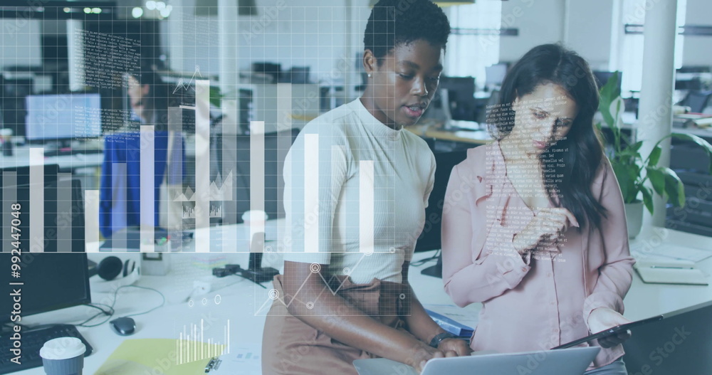 Obraz premium Analyzing data charts image over diverse businesswomen collaborating in office