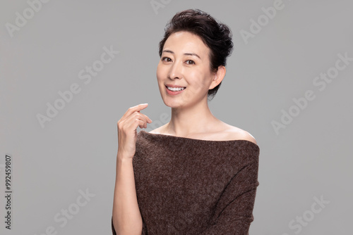 Studio Shot Of Beautiful Mature Woman photo