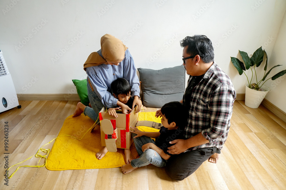 Asian Woman Wear Hijab Preparing Airplane Made of Cardboard Box For Son. Taking Care, Parenting at Home
Asian Woman Wear Hijab Preparing Airplane Made of Cardboard Box For Son. Taking Care, Parenting at Home