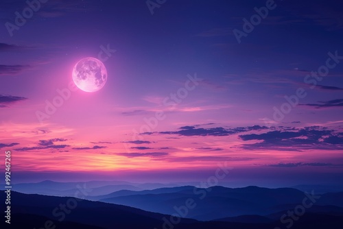 Pink Moon Rising Over Silhouetted Mountain Ranges