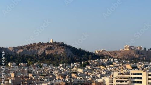 Lofos Philapappou and Acropolis in Athens seen in the distance, summer time photo