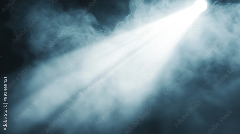Fototapeta premium Bright Spotlight Filtering Through Thick Smoke