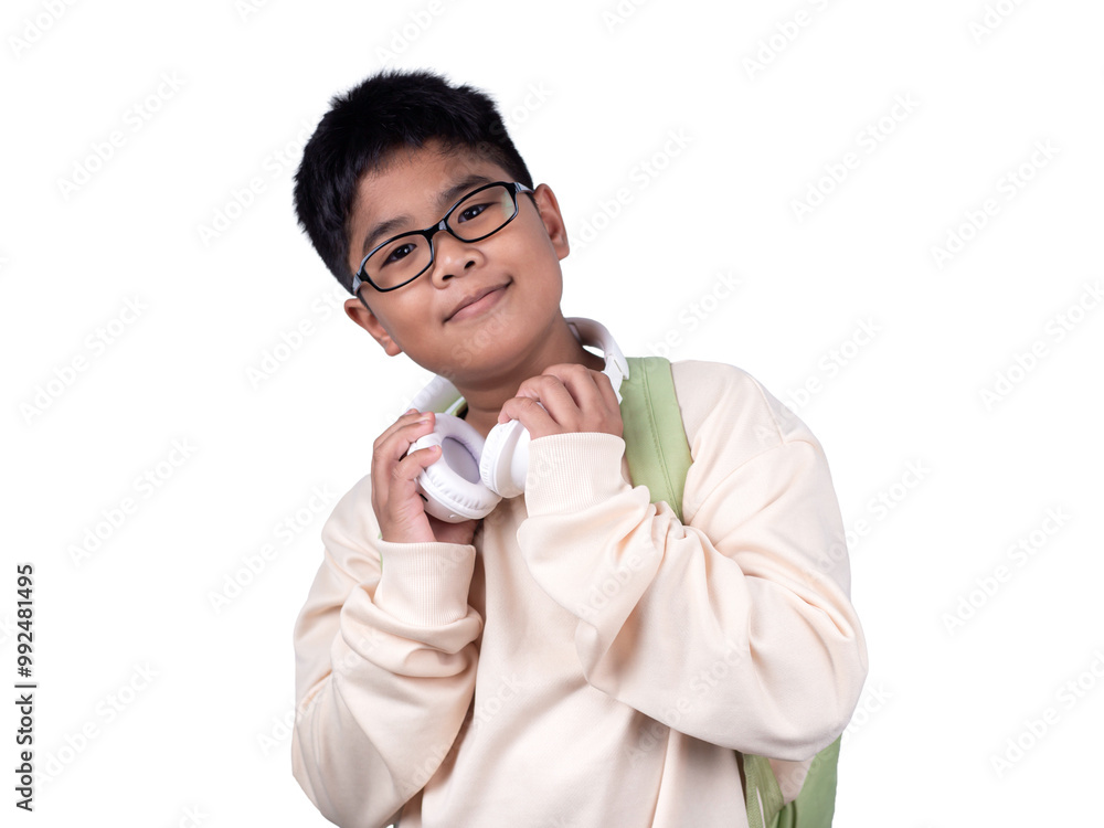 Portrait of boy in casual clothes carry a green bag and white headphones isolated on a white background, The concept of education and way of life. Cute boy posing in casual clothes with clipping part.