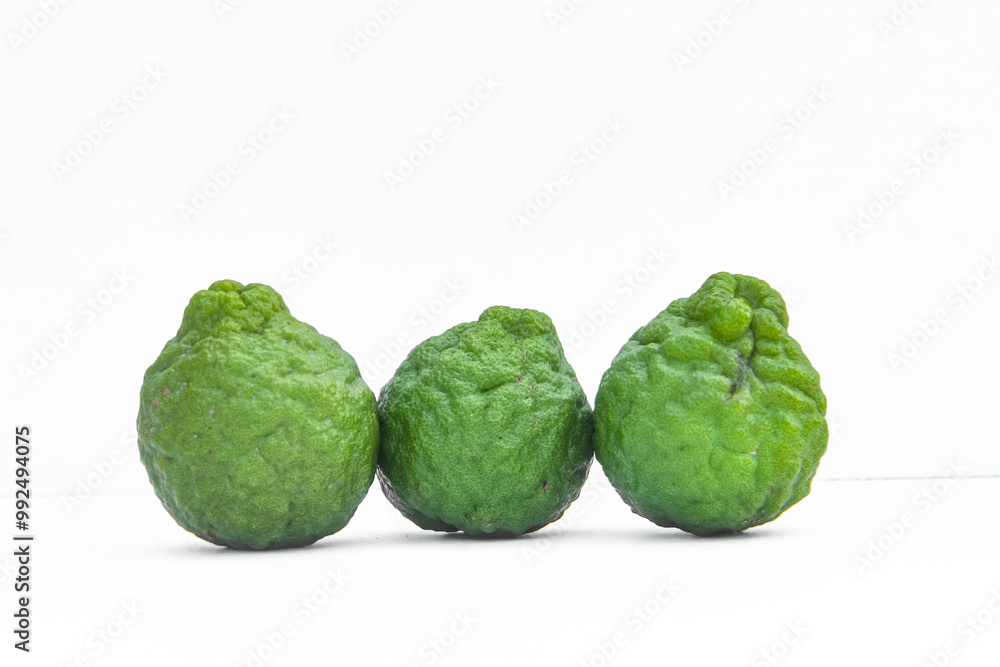 Fototapeta premium Citrus hystrix DC or kaffir lime or bergamot whole on isolated white background
