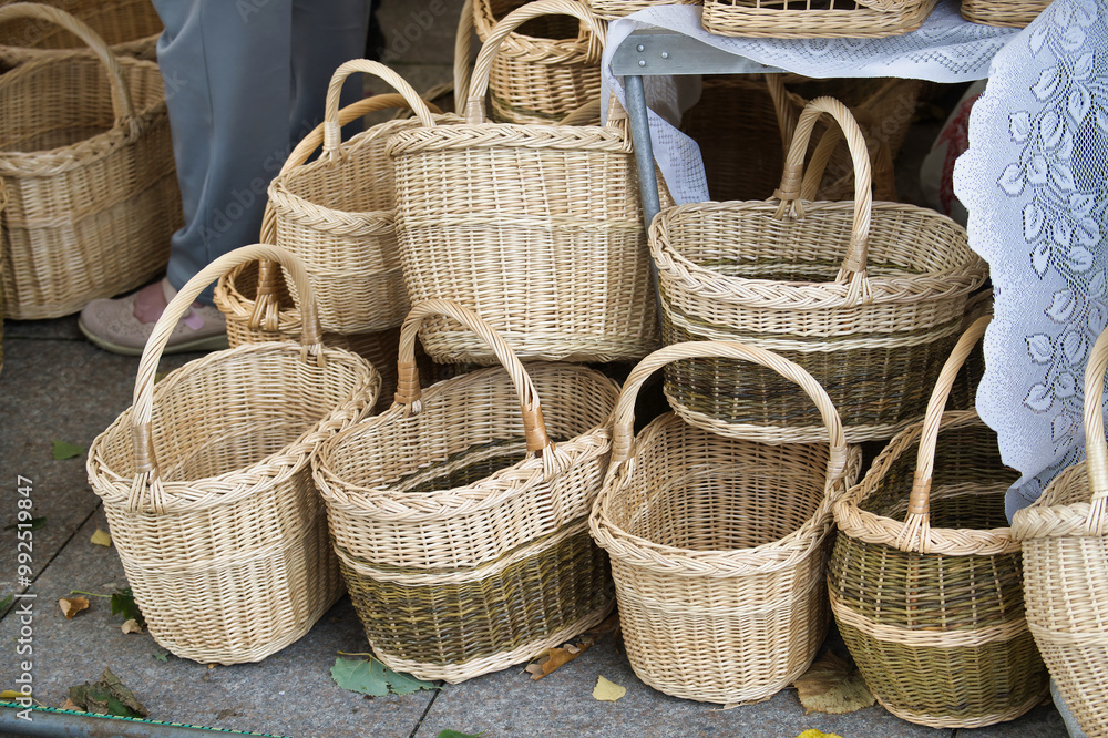 Collection of handcrafted wicker baskets showcasing traditional craftsmanship and natural materials Collection of handcrafted wicker baskets showcasing traditional craftsmanship and natural materials