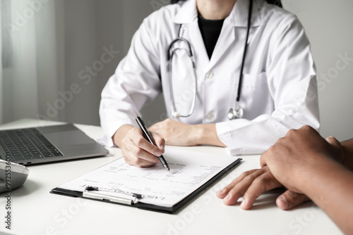 Female doctors who treat patients make an appointment to listen to the results after a physical examination and explain medical information and diagnose the disease. Medical concepts and good health