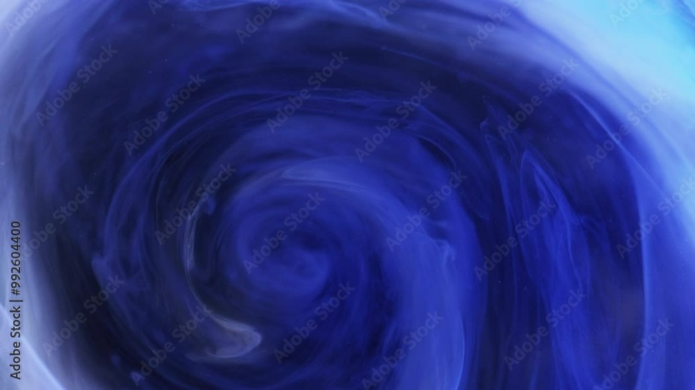Smoke vortex. Blur mist swirl. Storm twirl. Defocused blue paint water blend spiral rotating motion on dark black abstract art background. Smoke vortex. Blur mist swirl. Storm twirl. Defocused blue paint water blend spiral rotating motion on dark black abstract art background.