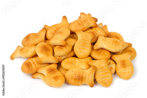 A pile of fish-shaped cookies isolated on a white background. Lots of fresh, crispy cookies.