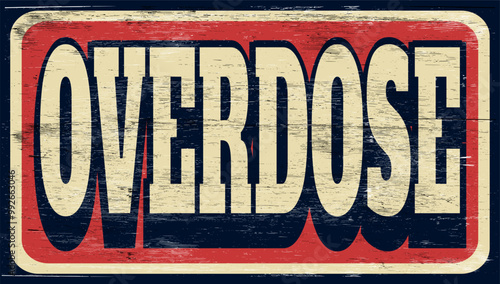 Aged and worn overdose sign on wood