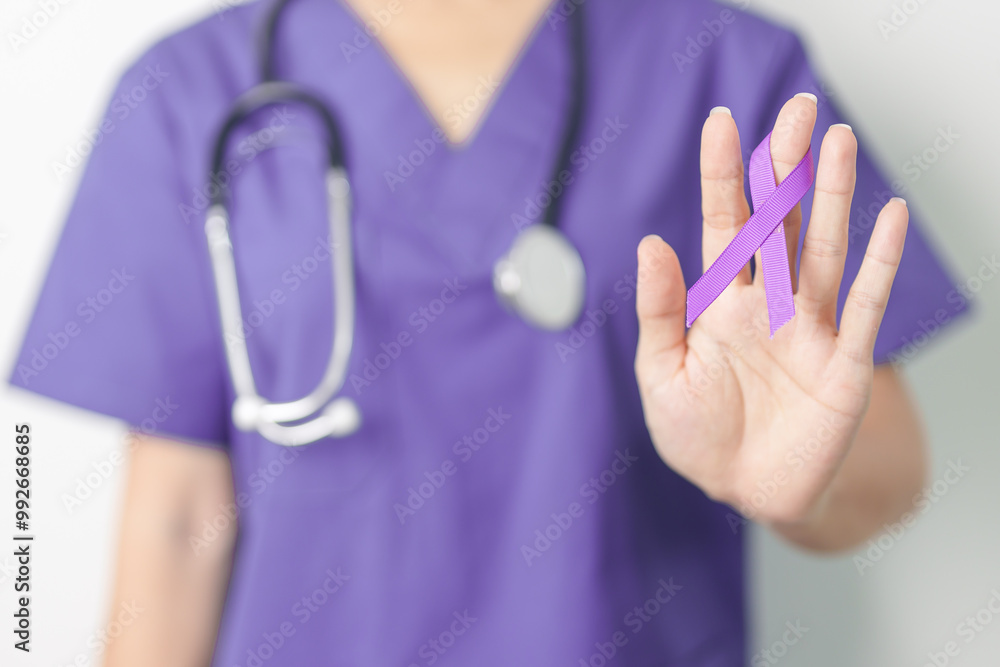 Doctor holding purple Ribbon for Violence, Pancreatic, Esophageal, Testicular cancer, Alzheimer, epilepsy, lupus, Sarcoidosis and Fibromyalgia. Awareness month and World cancer day concept Doctor holding purple Ribbon for Violence, Pancreatic, Esophageal, Testicular cancer, Alzheimer, epilepsy, lupus, Sarcoidosis and Fibromyalgia. Awareness month and World cancer day concept