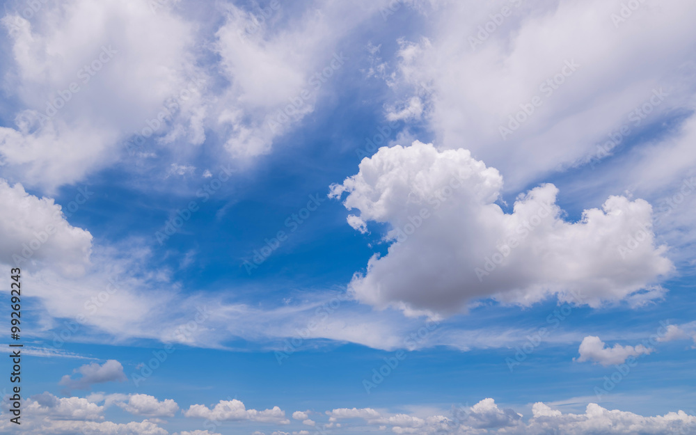 clear blue sky background,clouds with background, Blue sky background with tiny clouds. White fluffy clouds in the blue sky. clear blue sky background,clouds with background, Blue sky background with tiny clouds. White fluffy clouds in the blue sky.
