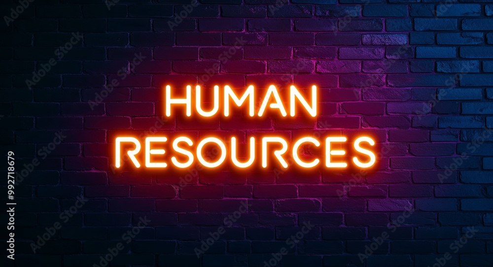 human resources word lettering glowing with neon light on dark brick wall background human resources word lettering glowing with neon light on dark brick wall background