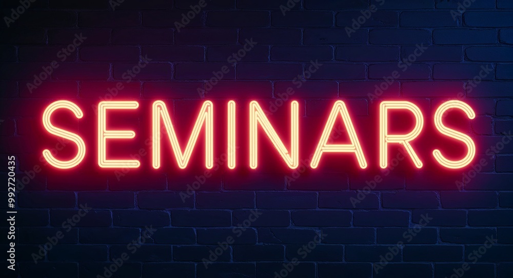 Obraz premium seminars word lettering glowing with neon light on dark brick wall background