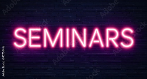 seminars word lettering glowing with neon light on dark brick wall background