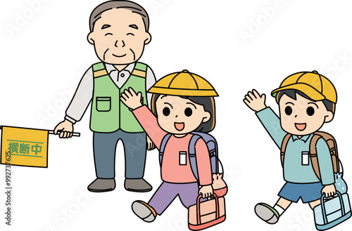 旗振りの男性と登校する小学生