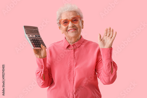 Senior woman with calculato...