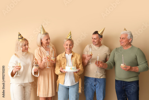 Mature people with cake and...