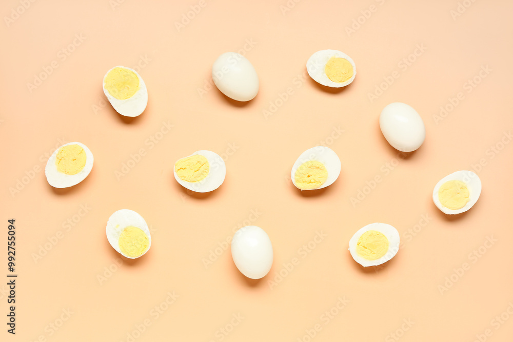 Tasty boiled eggs with halves on orange background Tasty boiled eggs with halves on orange background