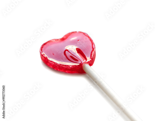 Red heart shaped lollipop isolated on white background